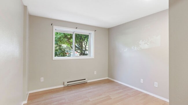 Building Photo - This ground floor corner-unit condo