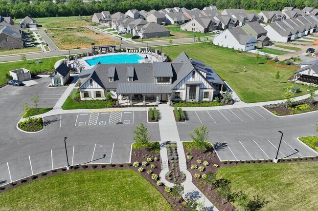 Building Photo - **BE THE LUCKY ONE TO LIVE IN THIS 2024-BUILT END-UNIT TOWNHOME IN A RESORT-STYLE COMMUNITY**