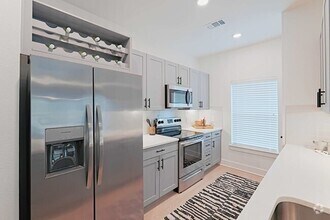 Building Photo - Get Up to $2,400 Off Your 2/2 Rent!