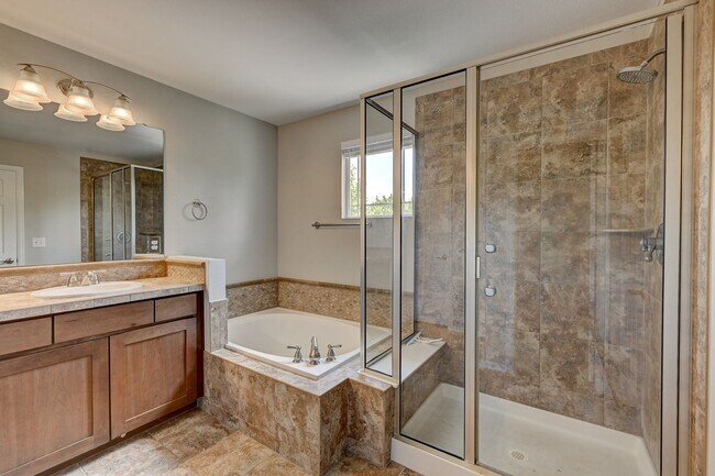 Building Photo - 5 bedroom, 4 bath home with 2 car attached garage