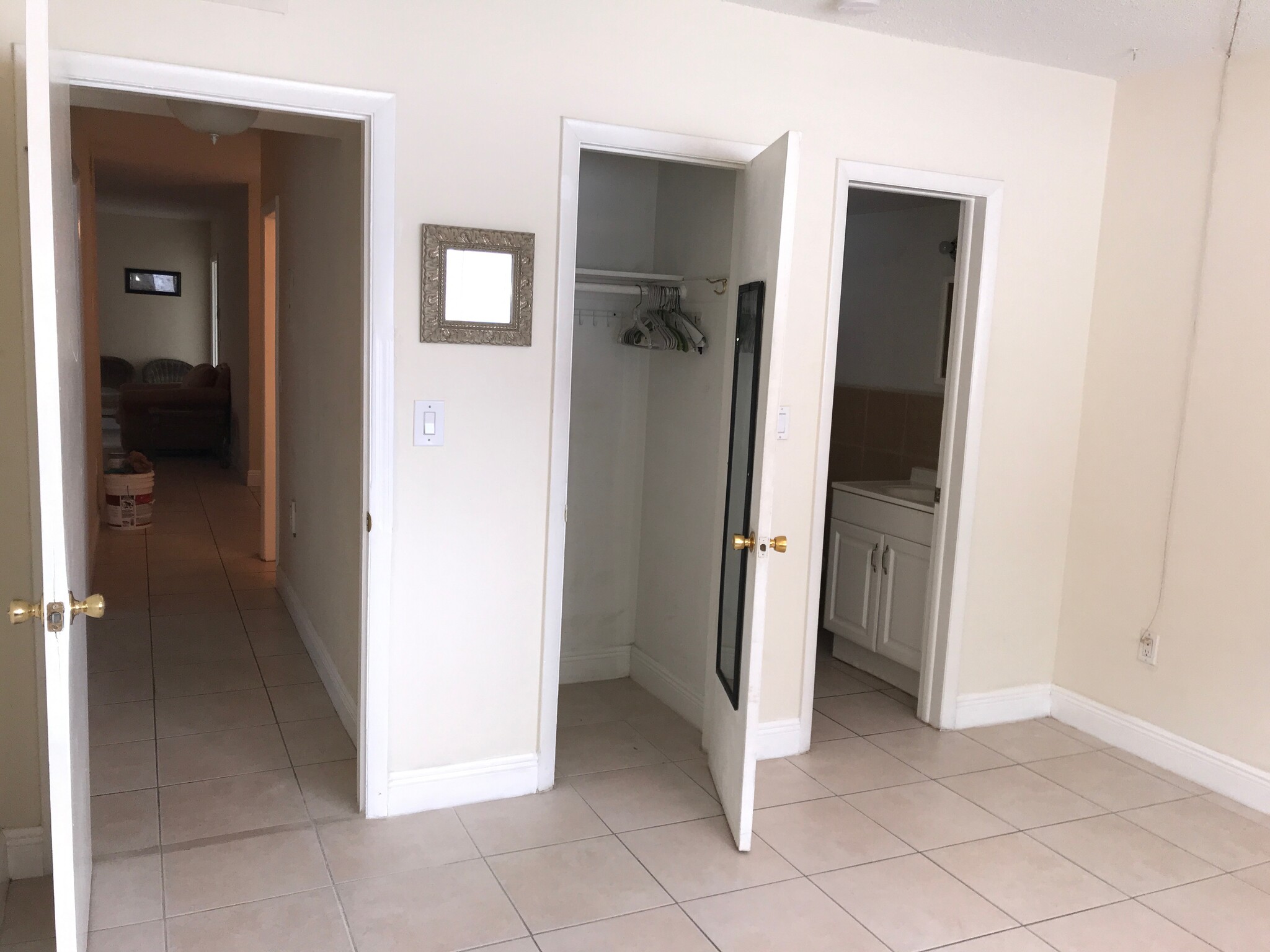 view of master closet and door into bathroom - 265 SW 7th St