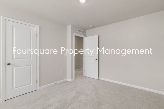 Building Photo - Coming Soon; July 27, 2026 : End unit ToSpacious End-Unit Townhome with 2nd Floor Loft, Screened-...