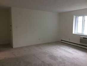 Building Photo - Two Bedroom with Heat & Parking Included Pet Friendly Top Floor