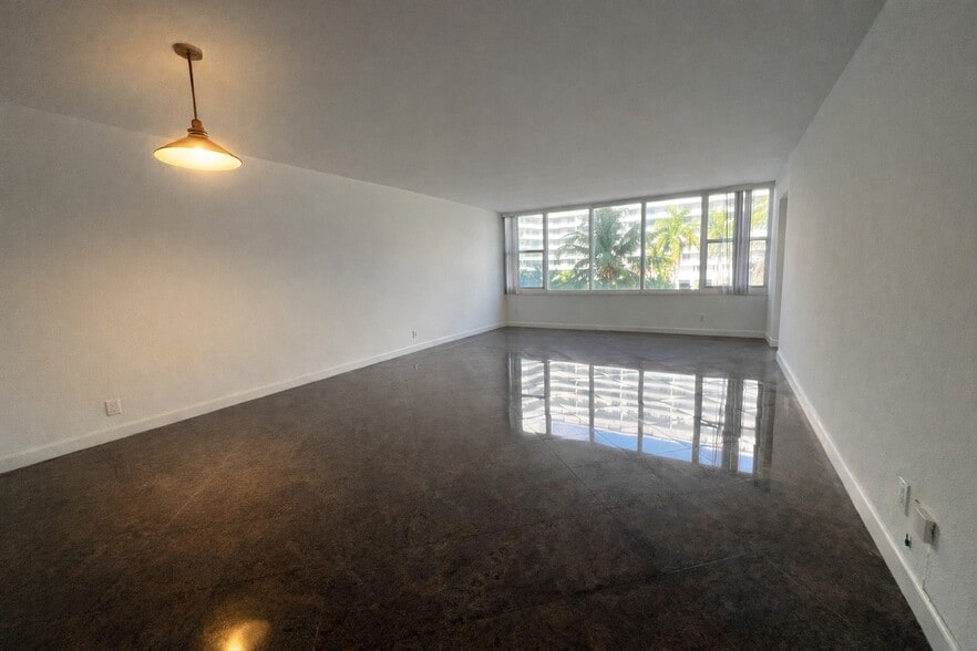 Living Area with Granite Floors - 5600 Collins Ave