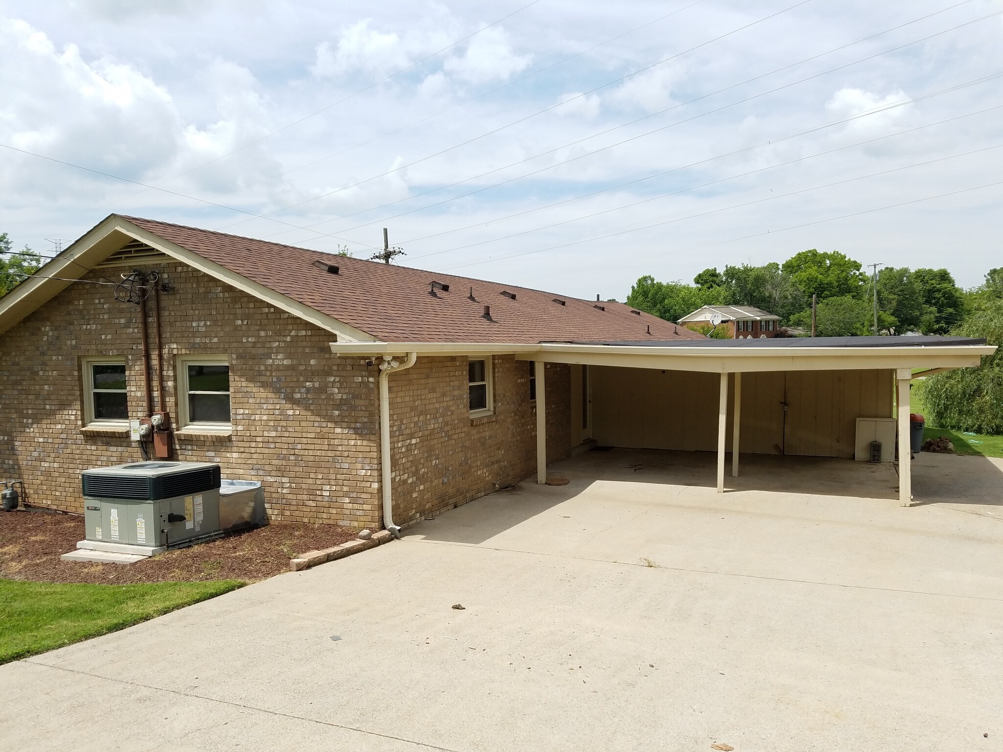 Two car covered carport with private storage unit attached to the carport. - 665 Harpeth Bend Dr