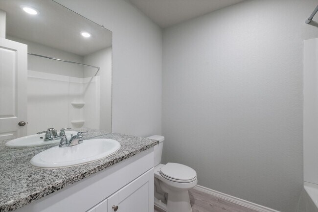 Building Photo - Open-Concept Living with New Flooring