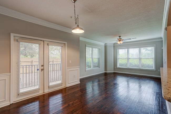 Living room and dining area with view of the HOA maintained outdoor space - 1850 Cotillion Dr