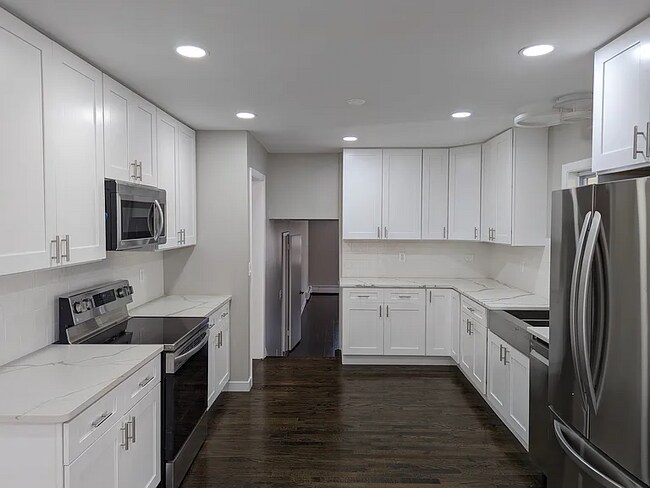Building Photo - this contemporary & brightly remodeled 2,400 sqft home