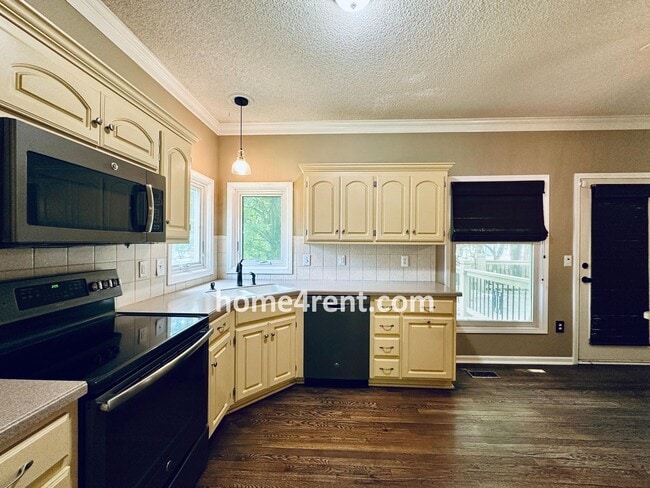 Building Photo - Blue Valley Schools w/ Wood Floors, Finished Basement and a Peaceful, Private Fenced Yard!