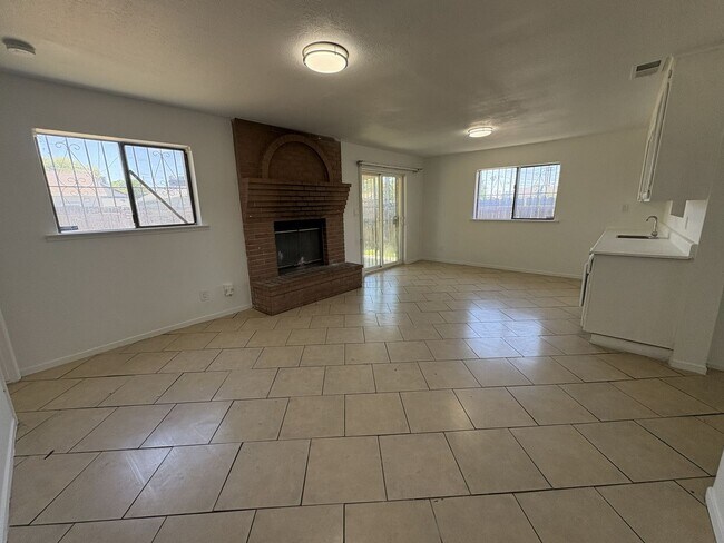 Building Photo - Large Living Area, rear yard has RV Access!