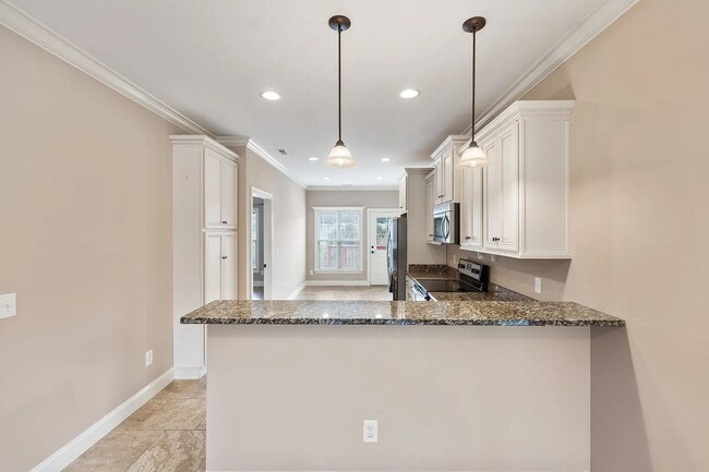 Building Photo - GORGEOUS FOURPLEX HOME - END UNIT