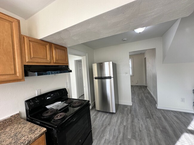 Building Photo - Three Bedroom Available Soon!