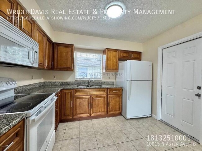 Building Photo - 10015 N Aster Ave