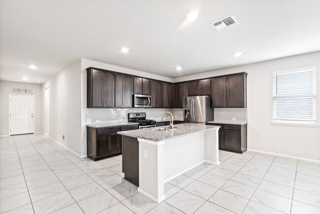 Building Photo - A rare true dual-suite floorplan in Alamo Ranch — two private en-suite bedrooms, single-story liv...