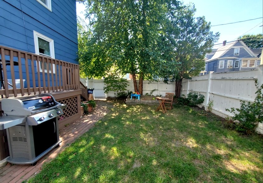Back yard. NOTE: Now even sunnier. Birch tree and sandbox since removed. - 59 Cameron Ave