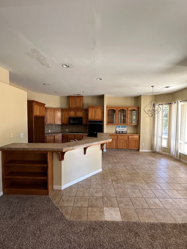 Building Photo - Spacious 4-Bed, 2-Bath Home in Gated Baker...