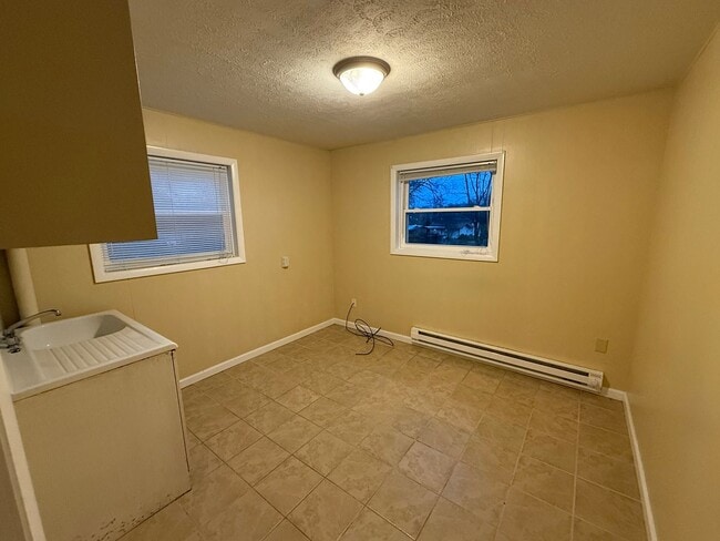 Building Photo - Updated 4BR Home with Finished Basement & Level Yard