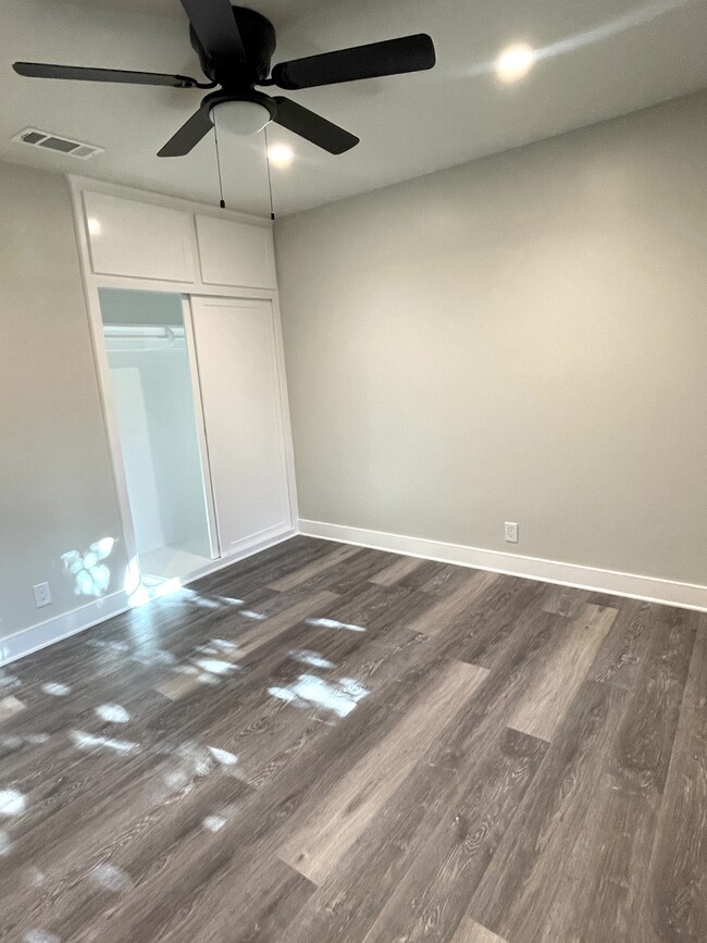 Bedroom with recessed dimmable lighting, ceiling fan, dual pane windows and ceiling fan - 3211 W Alameda Ave