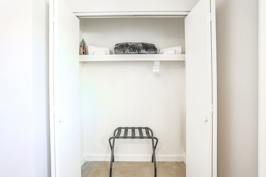 Closet with luggage rack, iron & ironing board - 2821 E Turney Ave