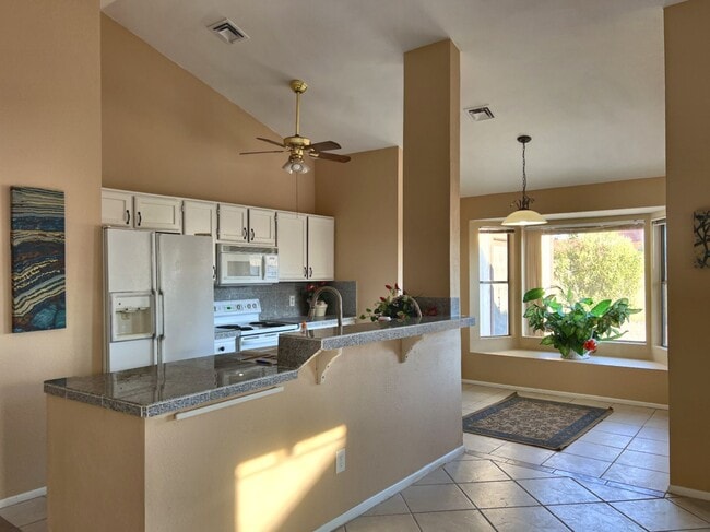 Building Photo - LARGE REMODELED 4BR 2BA HOUSE WITH GARAGE, GRANITE COUNTERS, BUILT-IN BREAKFAST BAR, TILE FLOORS