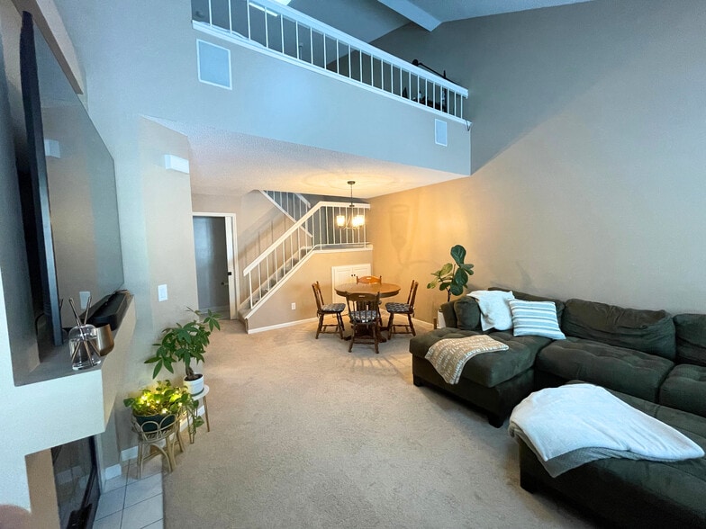 Living room has a vaulted ceiling with 2 skylights. - 15805 24th Ave N.