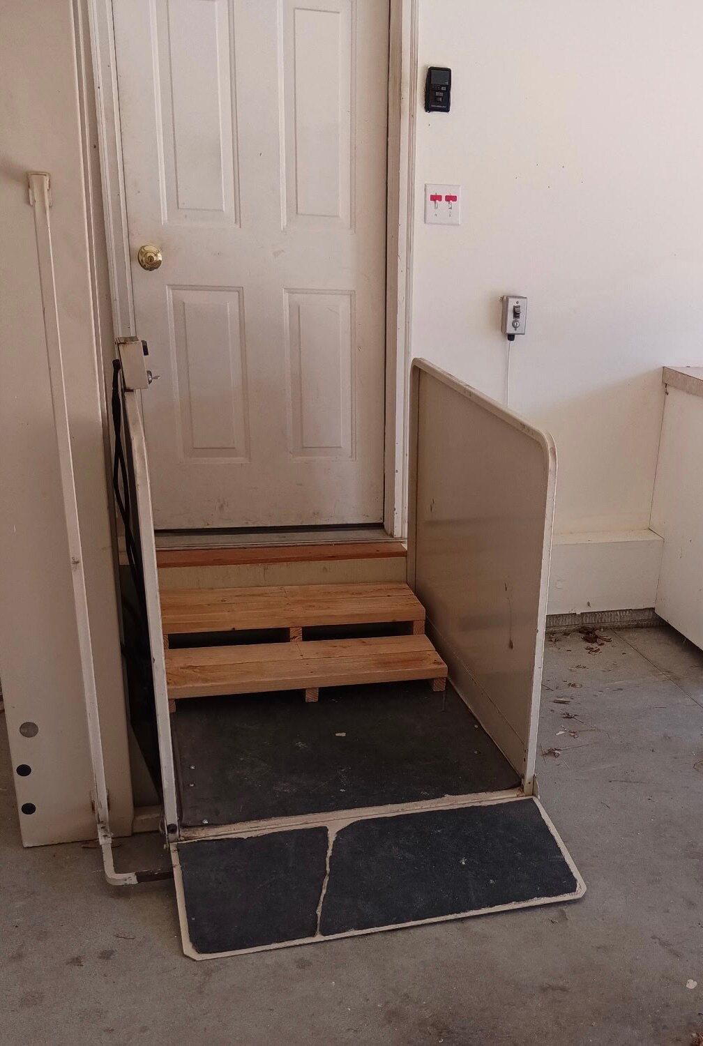 Stairs or wheelchair lift entrance to house in garage - 2928 Blackhawk Dr