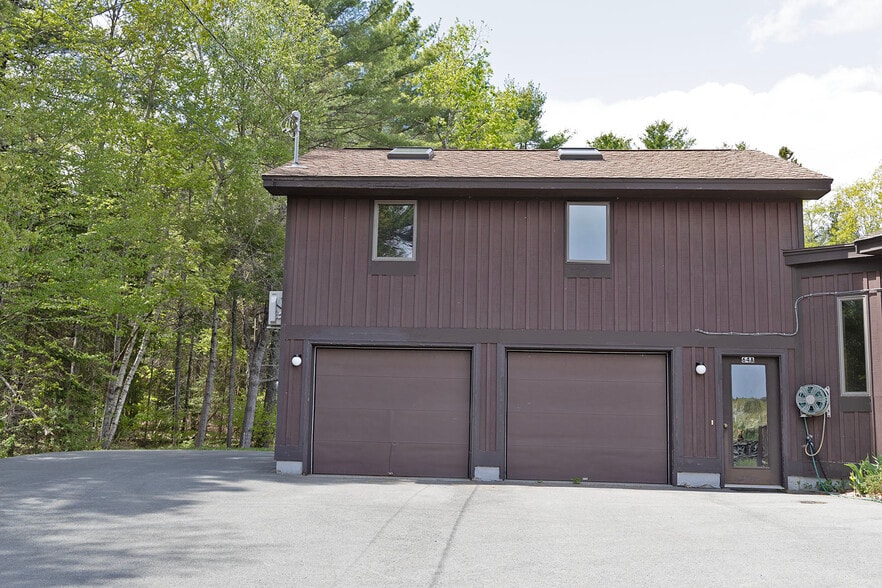Upstairs apt over garage; front windows & 2 skylights; entrance door partially shows on right - 64 Gardner Rd