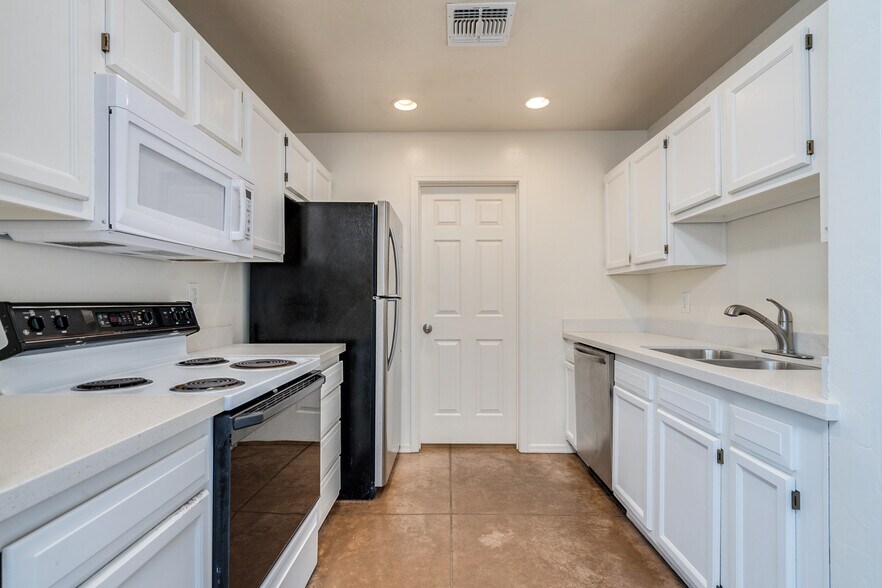 Kitchen includes electric stove oven, microwave, dishwasher, refrigerator - 3138 E Adams St