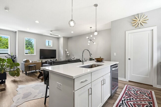 Building Photo - Live Elevated in Downtown Raleigh – Stunning Townhome with Rooftop Oasis!