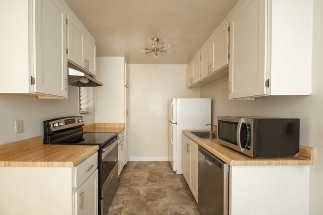 Building Photo - Peaceful Forest-View Condo with Fireplace & Private Balcony in Golden Oaks