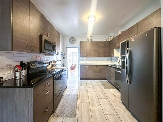 Building Photo - A home where old-world charm meets modern sophistication!
