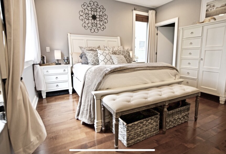 Huge walk-in closet off bedroom with floor to ceiling shelves and racks. - 1535 North Philip Street