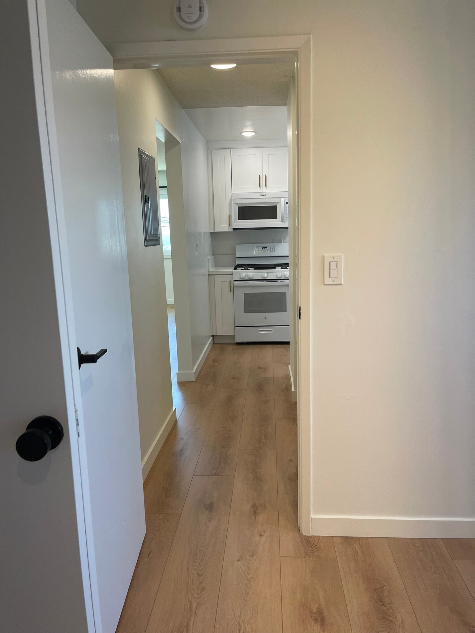 View from bedroom to kitchen. - 1039 6th St