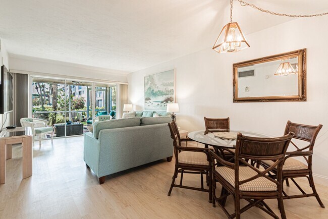 Building Photo - AVAILABLE NOW! Furnished Ground-Floor End Unit | Lake & Pool Views | Minutes to Marco Island & Do...