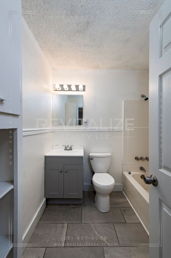 Building Photo - 3 BR 2 BA Home with Fenced Yard & Carport