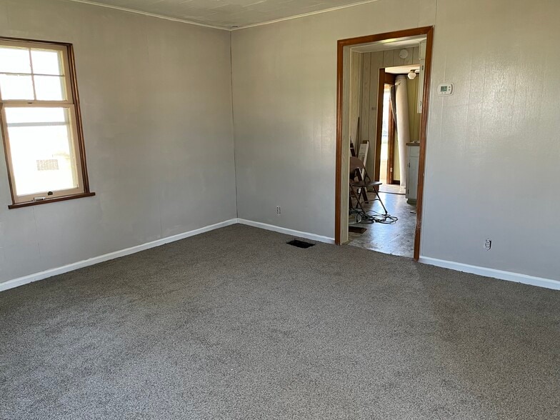 living/bedroom looking into the kitchen - 200 E 6th St