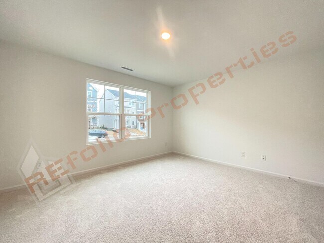 Building Photo - Brand New 3 Story, 4 bedroom, 3.5 bathroom Townhome Featuring a 1st floor Guest Suite, 2 Car Gara...