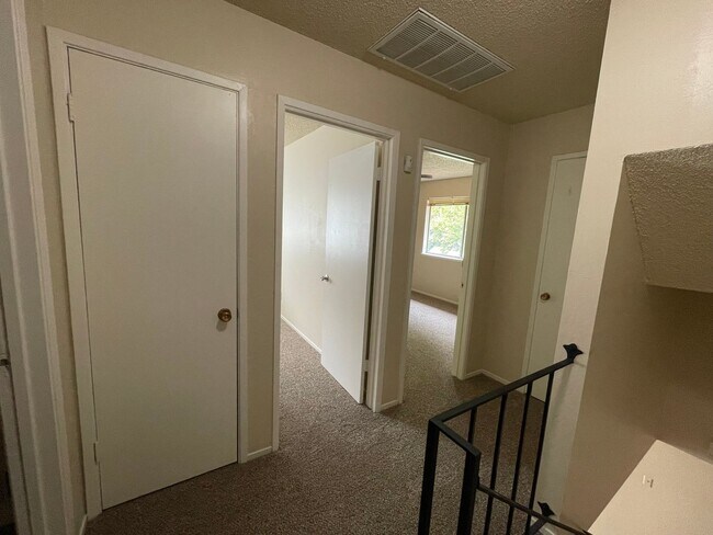 Building Photo - Two Story Fourplex Unit - On site Laundry, Carport, Ceiling Fans