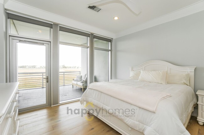 Building Photo - Waterfront Oasis: Fully Furnished 1BR/1.5BA with Marsh Views