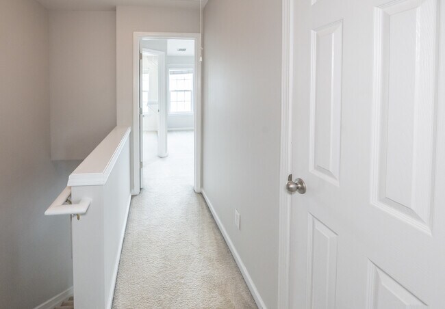 Hallway between master bedrooms for privacy. - 2922 Duvalla Ave