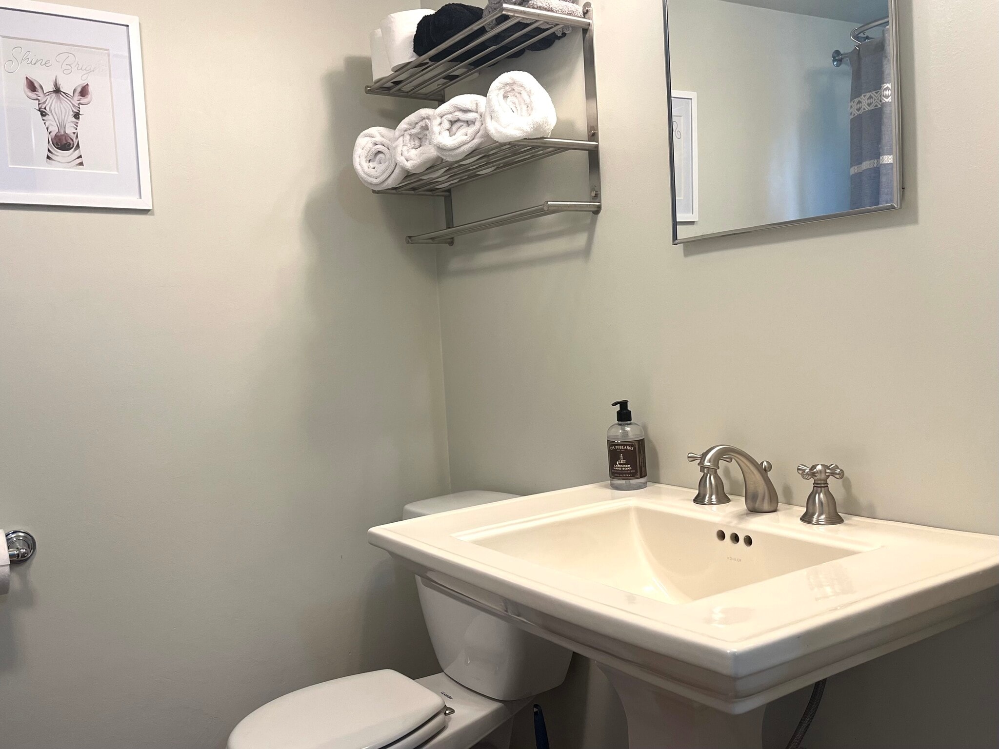 Pedestal sink in the bathroom. - 414 S Commercial St