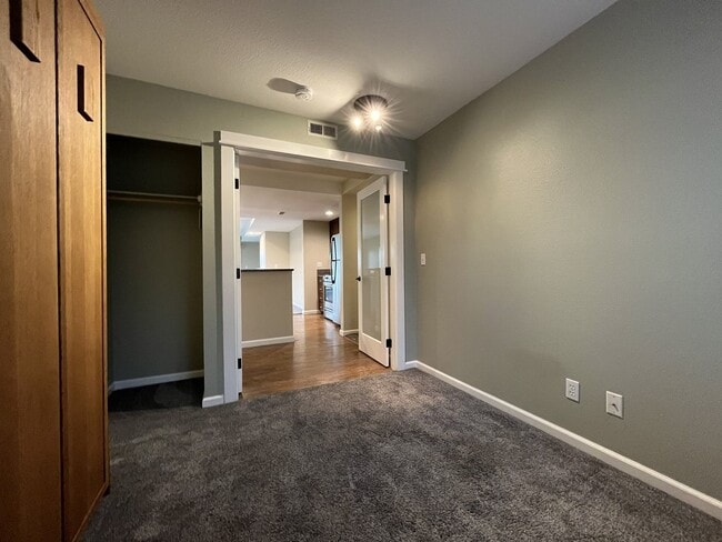 Building Photo - Ground Floor End Unit on Jantzen Beach with River Views & Flexible Living Space