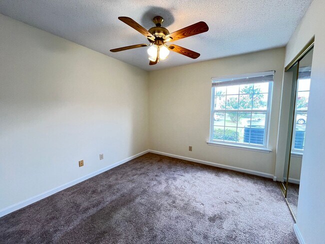Building Photo - First Floor, Unfurnished, 3 Bedroom, 2 Bath Condo with Screened-in Back Patio!