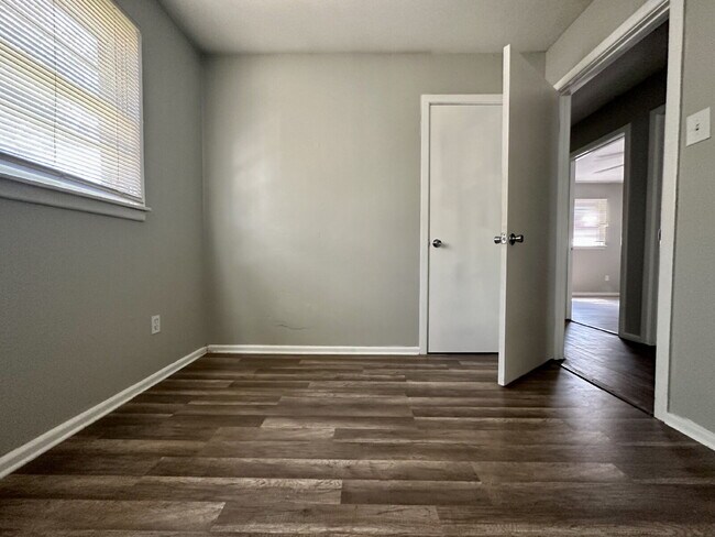 Building Photo - Updated Home with Gorgeous Floors & Large Backyard