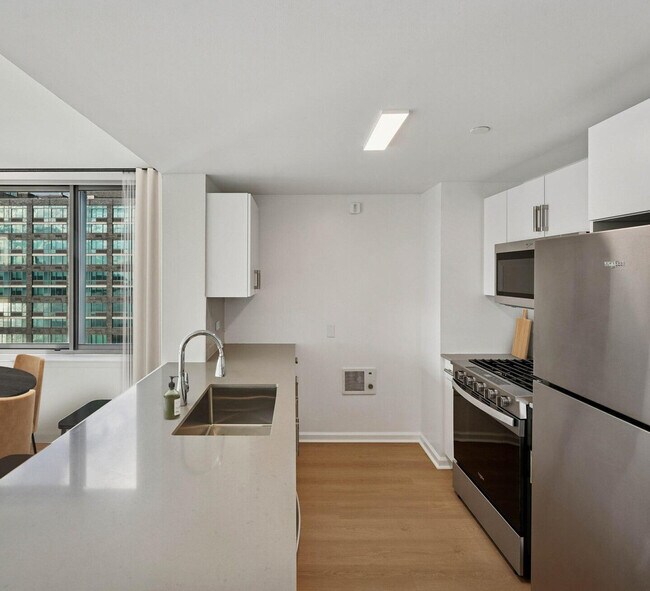 Building Photo - 4-75-75 48th Ave