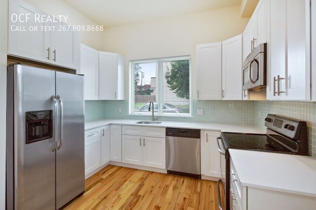 Primary Photo - Modern Two Bed Bi-Level Apt w/ Finished Ba...