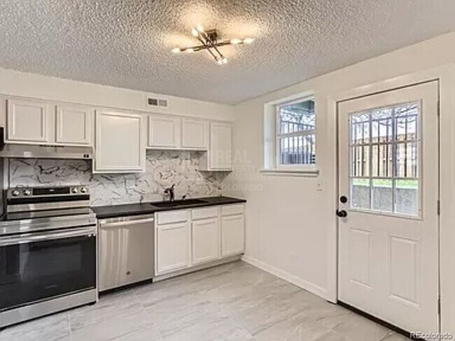 Building Photo - 9110 E Girard Ave