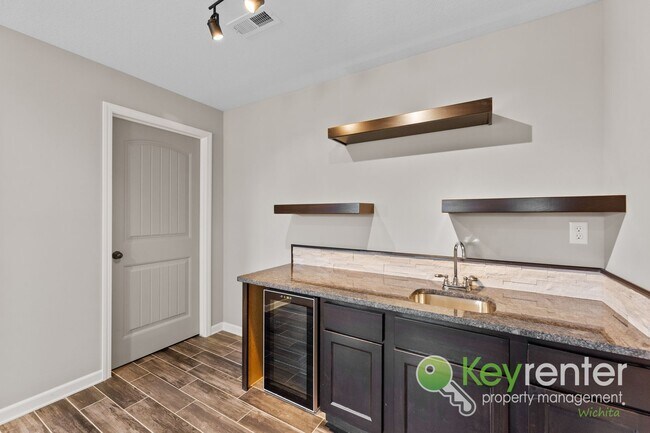 Building Photo - Spacious 4-Bedroom Home with Finished Basement & 3-Car Garage – Derby, KS