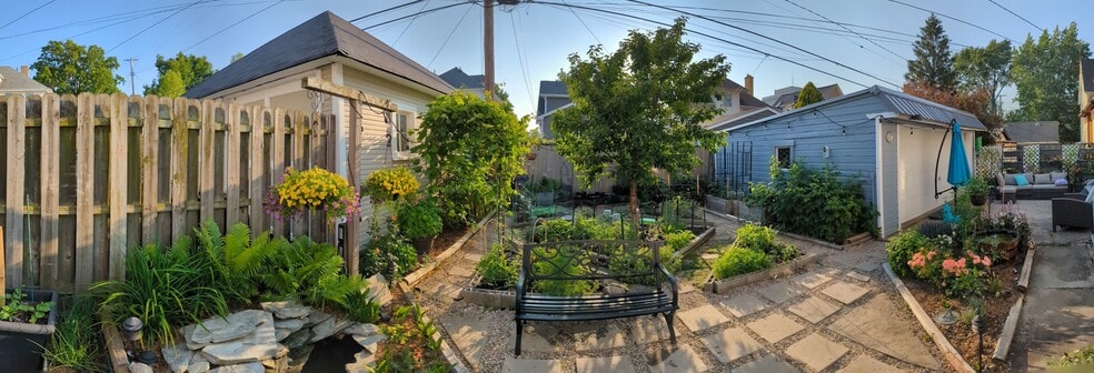 backyard garden with paths to walk through and a shared seating area in the summer - 1448 Lincoln Ave