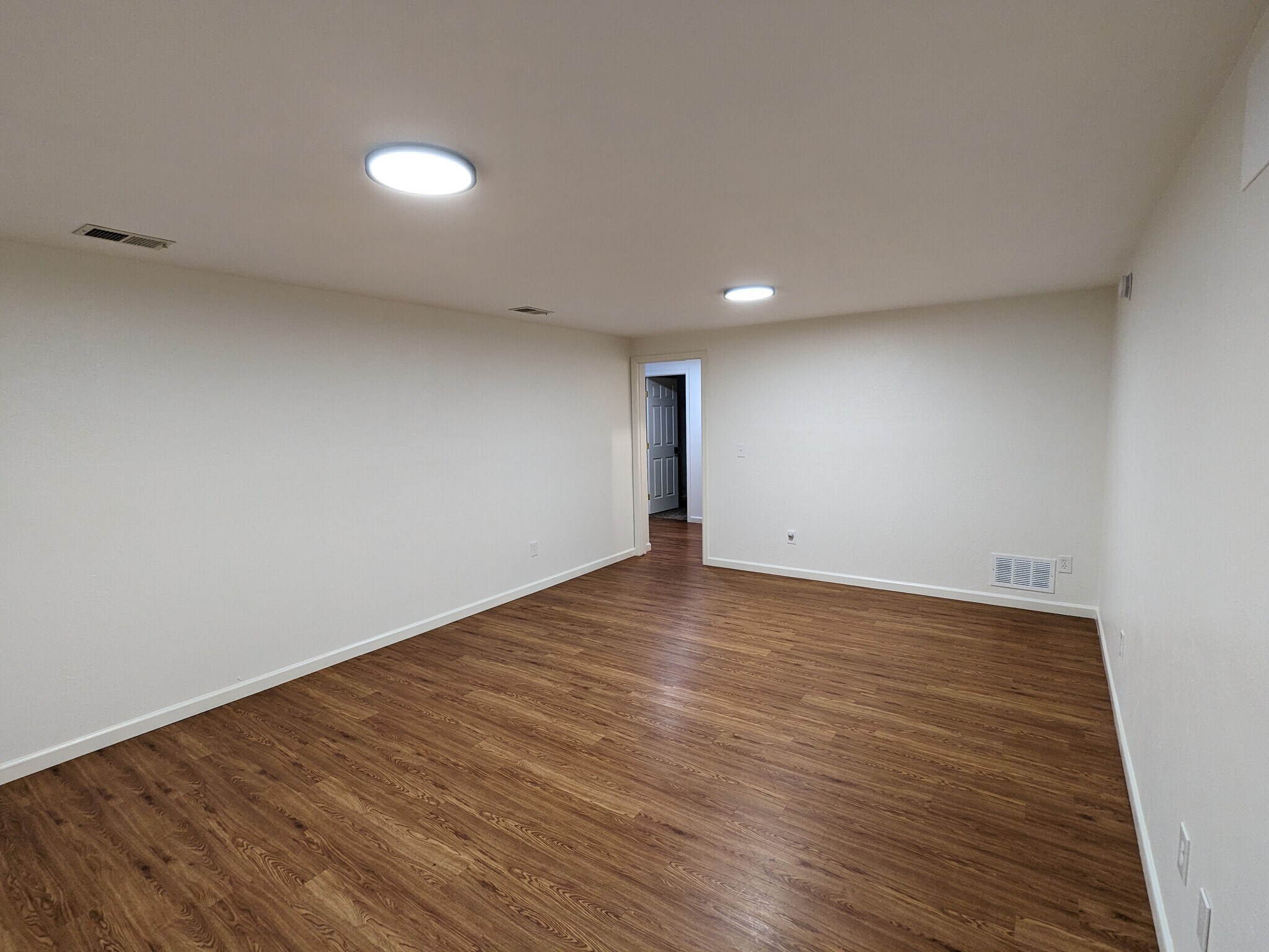 Lower Level Living Room - 525 Manhattan Dr